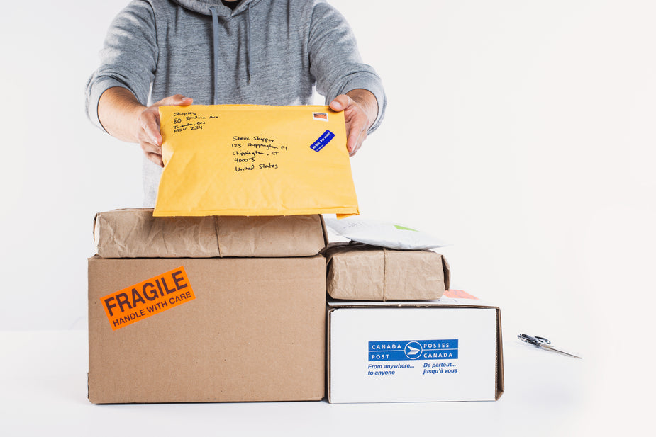 Warehouse staff preparing beauty and cosmetics fulfillment parcels