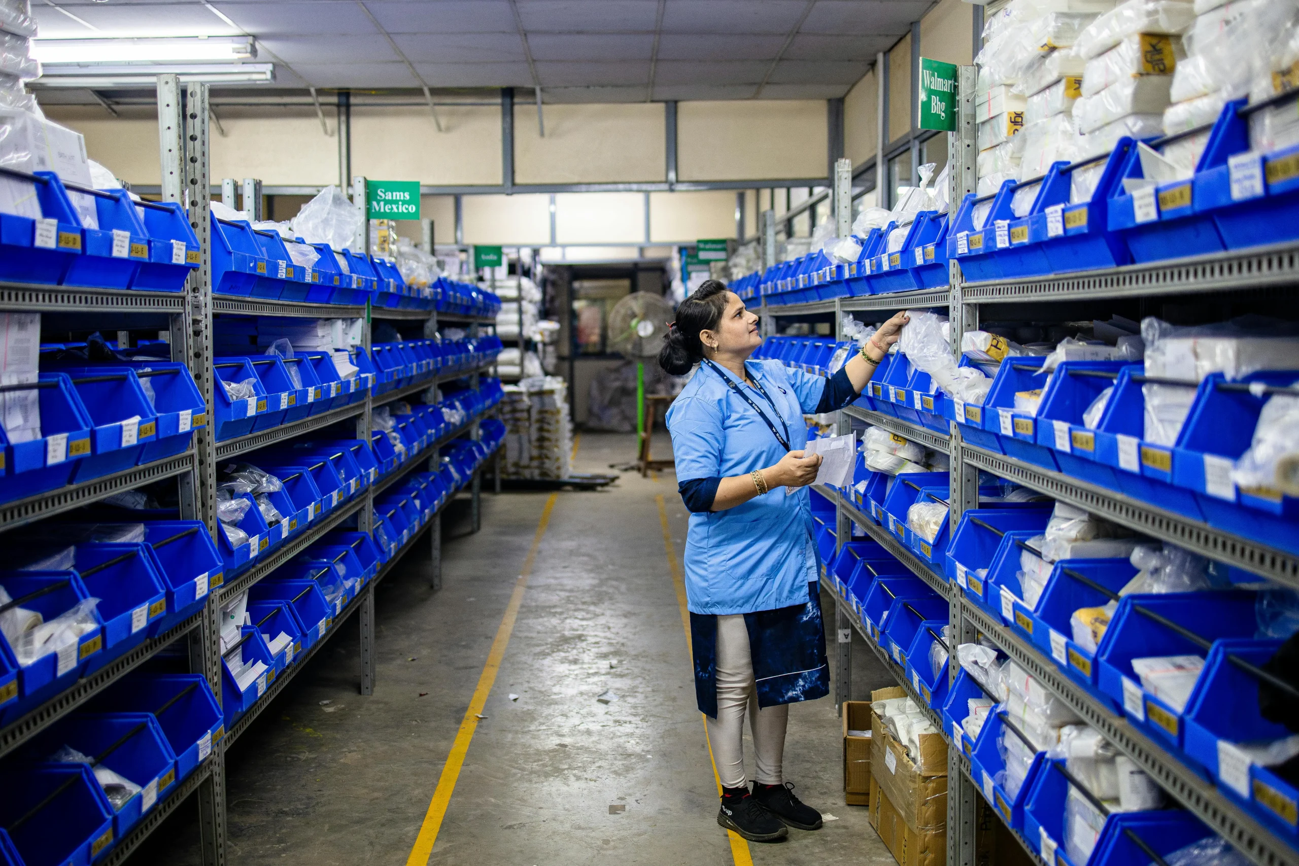 Warehouse shelves and cartons used for storage and handling calculations